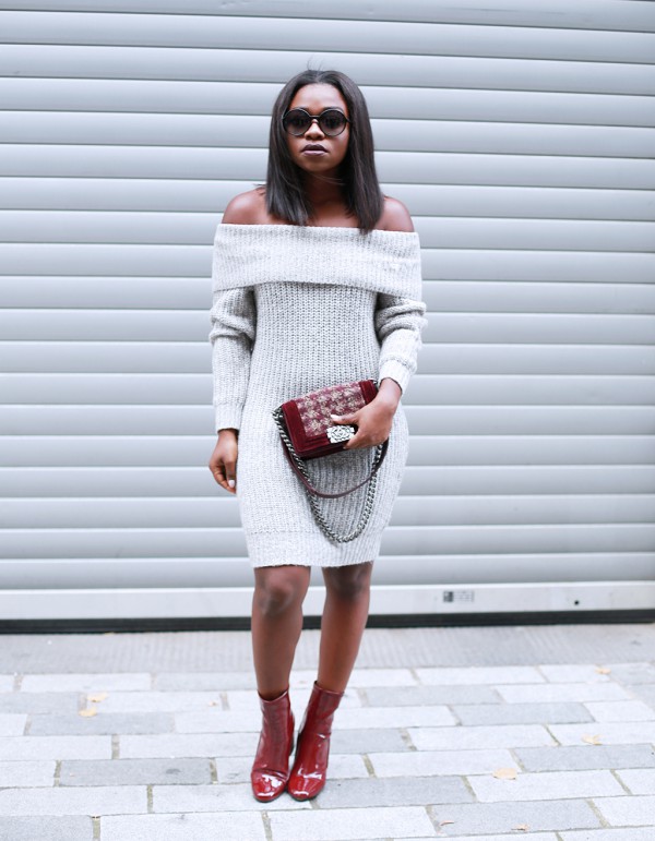 Fisayo-Longe-Grey-Off-the-Shoulder-Knit-Dress-Burgundy-Boots-Matching-Handbag-OnGiselleAve